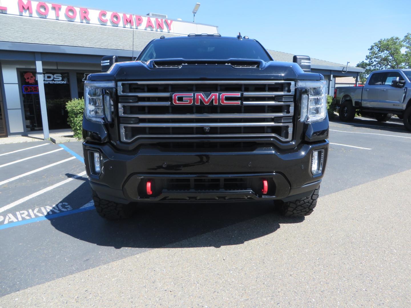 2020 BLACK /BLACK GMC Sierra 2500HD AT4 (1GT49PE76LF) with an 6.6L V8 engine, automatic transmission, located at 2630 Grass Valley Highway, Auburn, CA, 95603, (530) 508-5100, 38.937893, -121.095482 - Features a 3" BDS level kit with Fox shocks, 35" Toyo RT trail tires, 17" Method race wheels, JL audio Subwoofer, Window tint, and a power Tonneau cover. - Photo#1